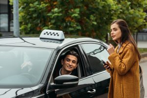 young-woman-holding-smartphone-and-talking-to-smil-2023-11-27-05-00-23-utc-1